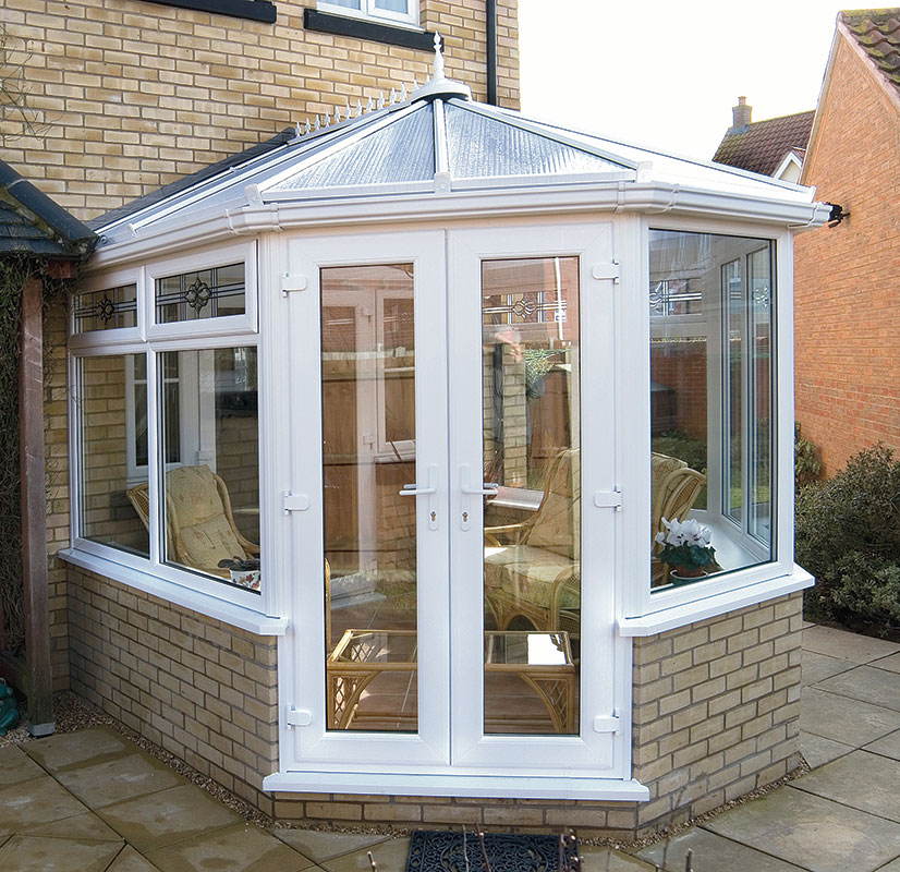 French door installation connecting a conservatory space
