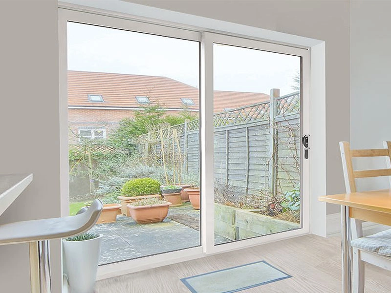Bright living room with large patio doors partially open to the garden
