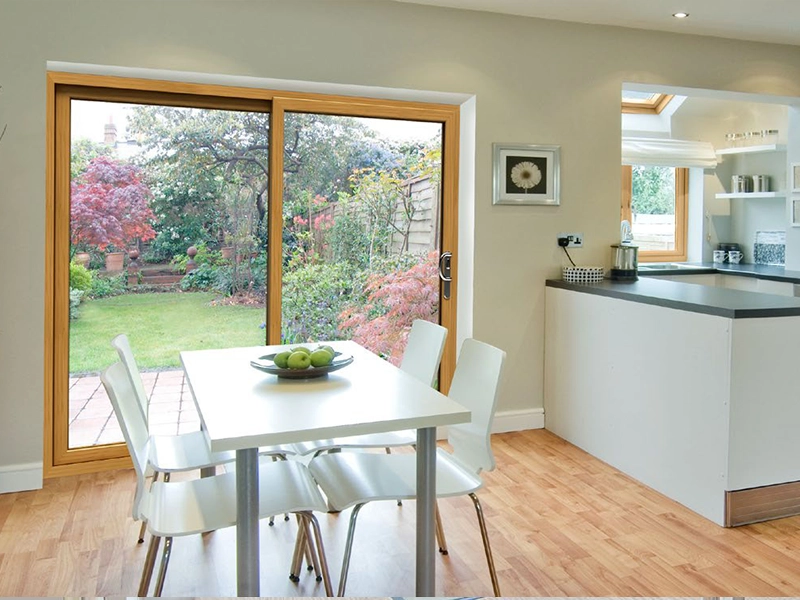 Kitchen and dining area with woodgrain sliding patio doors