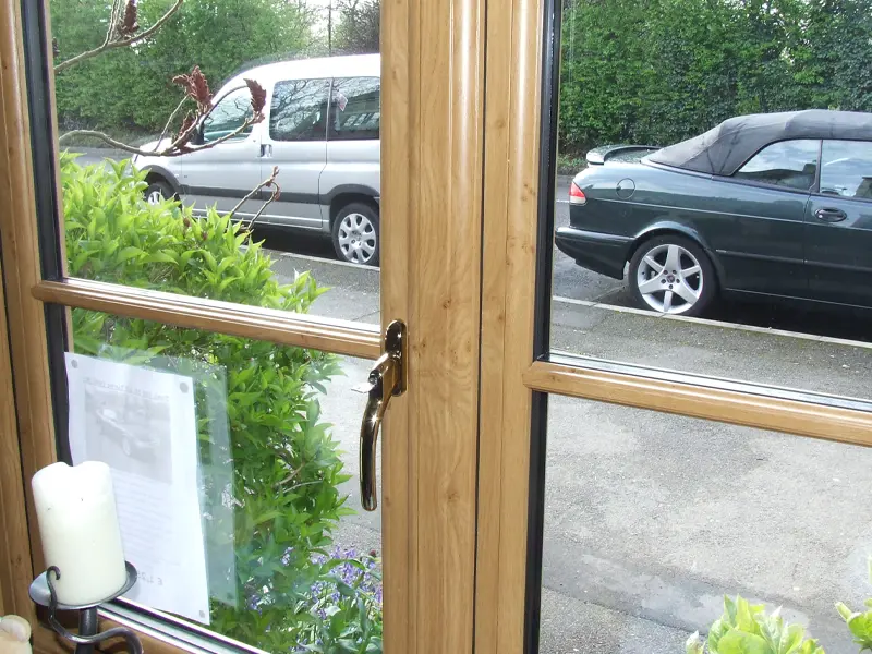 Close-up of secure locking hardware on a casement window