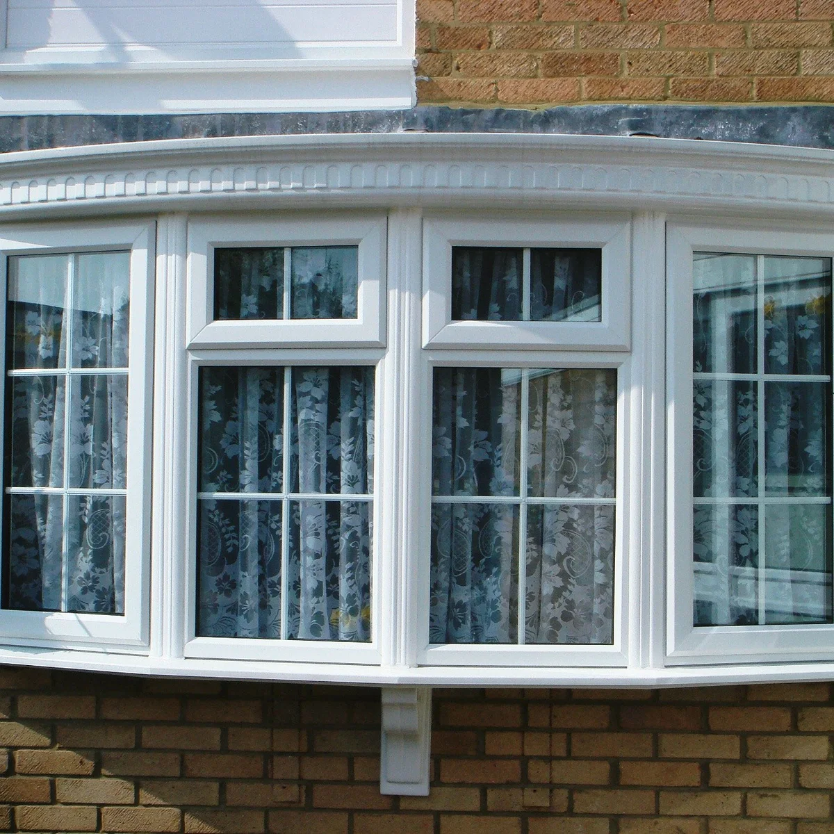 Large bay window arrangement bringing deep daylight into a living area