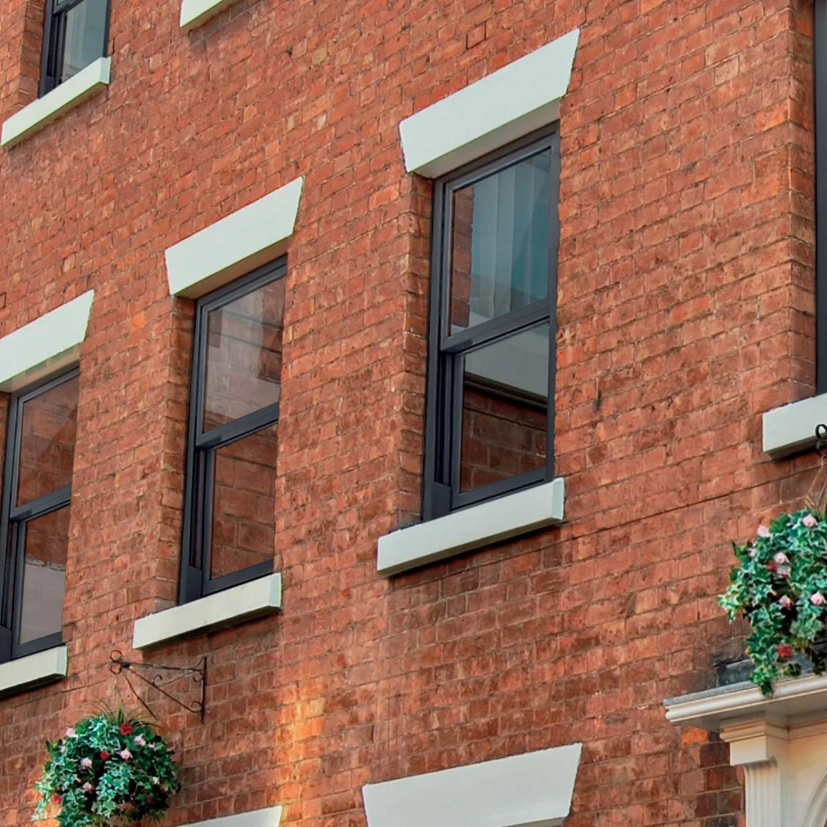 Vertical sliding window installation across a period-style home