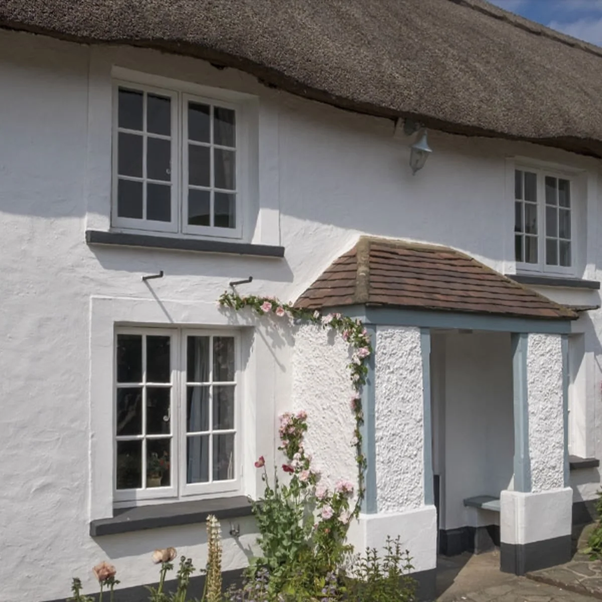 Timber-style window installation on a rural home elevation