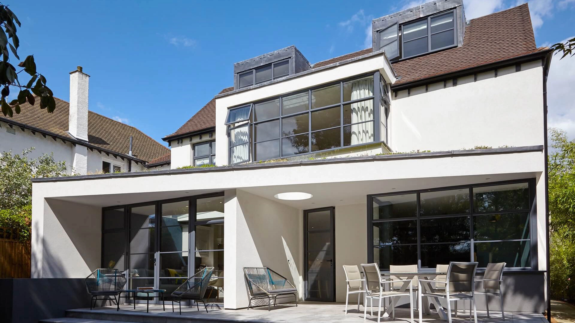 Black aluminium heritage windows installed on a brick exterior