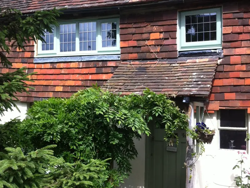 Single-colour white door and frame finish on a clean exterior scheme